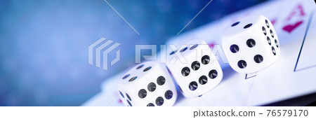 Online gaming platform, casino and gambling business. Cards, dice on laptop keyboard 76579170