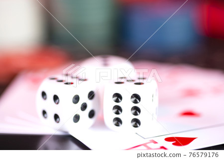 The casino dice lie on the poker cards. Gambling, casino The casino dice lie on the poker cards. Gambling, casino 76579176