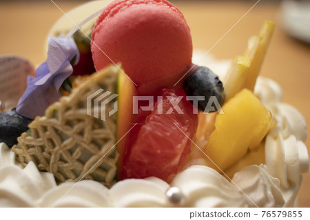 Cake decorated with macaroons Cake decorated with macaroons 76579855