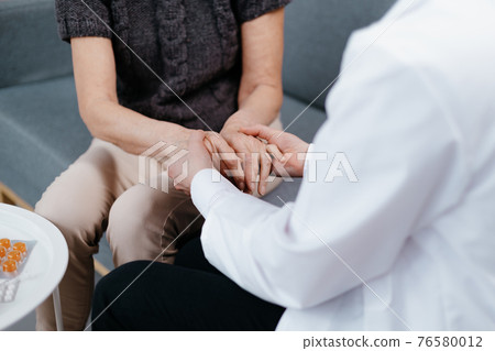 doctor is advising and soothing the woman during a home visit. doctor is advising and soothing the woman during a home visit. 76580012