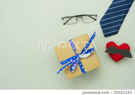 Table top view Happy Fathers day holiday background concept.Flat lay gift box for dad with accessories objects sign of season on modern rustic grey paper at home office desk.space creative design. Table top view Happy Fathers day holiday background concept.Flat lay gift box for dad with accessories objects sign of season on modern rustic grey paper at home office desk.space creative design. 76581243