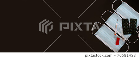 Banner - medical masks, medical thermometer, pills in a blister. Banner - medical masks, medical thermometer, pills in a blister. 76581458