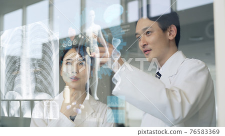 Men and women in white coats looking at the screen Electronic medical record Medtech 76583369