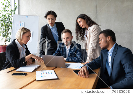 Group Of Multiethnic Business People Working On Laptop In Office Group Of Multiethnic Business People Working On Laptop In Office 76585098