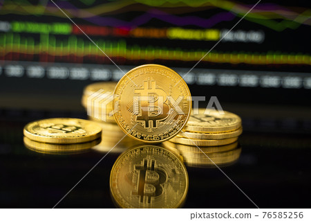 Gold bitcoin coin with a graph chart. Trading on the cryptocurrency exchange. Cryptocurrency Stock Market Concept. Virtual money concept. Mining or blockchain technology. Gold bitcoin coin with a graph chart. Trading on the cryptocurrency exchange. Cryptocurrency Stock Market Concept. Virtual money concept. Mining or blockchain technology. 76585256