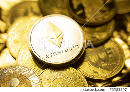Gold ethereum coins on a golden background among another crypto coins. Trading on cryptocurrency exchange. Cryptocurrency Stock Market Concept. Virtual money concept. Mining blockchain technology. 76585297