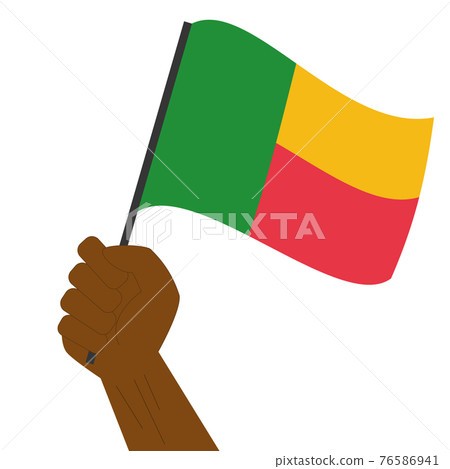 Hand holding and raising the national flag of Benin 76586941