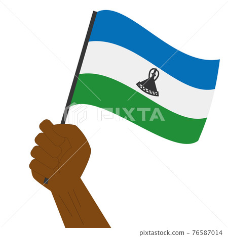 Hand holding and raising the national flag of Lesotho 76587014