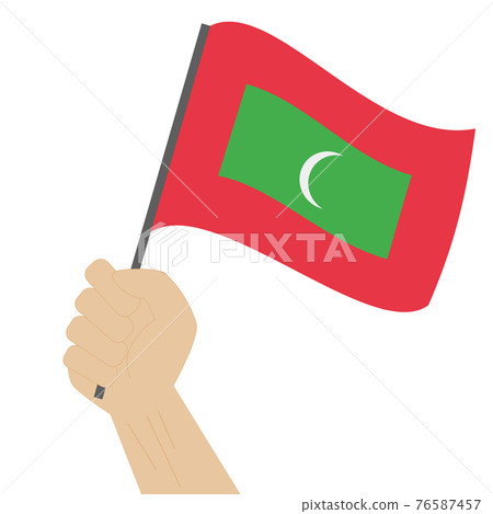Hand holding and raising the national flag of Maldives Hand holding and raising the national flag of Maldives 76587457