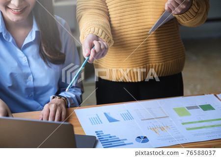 Fund managers team consultation and discuss about analysis Investment stock market by financial report. 76588037