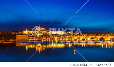 View of Charles Bridge Karluv most and Prague Castle Prazsky hrad in twilight. Panorama View of Charles Bridge Karluv most and Prague Castle Prazsky hrad in twilight. Panorama 76588681