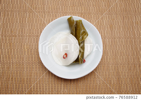 Turnips pickled in spicy sweet and sour sauce Turnips pickled in spicy sweet and sour sauce 76588912