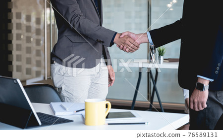 Business partnership meeting concept. Image businessmans handshake. Successful businessmen handshaking after good deal. 76589131
