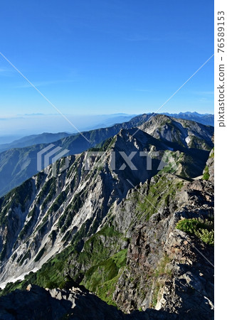 Near the top of Mt. Shirouma, Mt. Shirouma shining in the morning sun 76589153