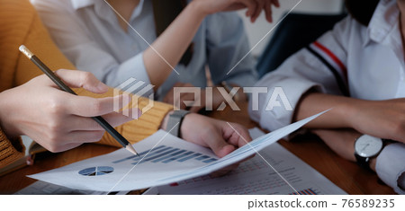 Group of Businessman and Accountant checking data document on digital tablet for investigation of corruption account . Anti Bribery concept. Group of Businessman and Accountant checking data document on digital tablet for investigation of corruption account . Anti Bribery concept. 76589235
