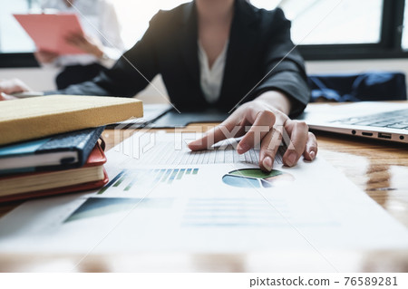 Fund managers team consultation and discuss about analysis Investment stock market by data document. Fund managers team consultation and discuss about analysis Investment stock market by data document. 76589281