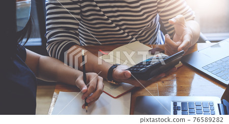 Business Team Meeting to brainstorming and discuss to audit finance planning sales. Financial advisor teamwork and accounting concept. Business Team Meeting to brainstorming and discuss to audit finance planning sales. Financial advisor teamwork and accounting concept. 76589282
