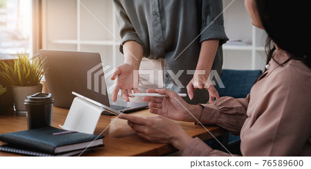 Fund managers team consultation and discuss about analysis Investment stock market by digital tablet. Fund managers team consultation and discuss about analysis Investment stock market by digital tablet. 76589600