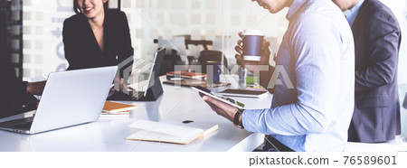 Group of Businesswoman and Accountant checking data document on digital tablet for investigation of corruption account . Anti Bribery concept. Group of Businesswoman and Accountant checking data document on digital tablet for investigation of corruption account . Anti Bribery concept. 76589601