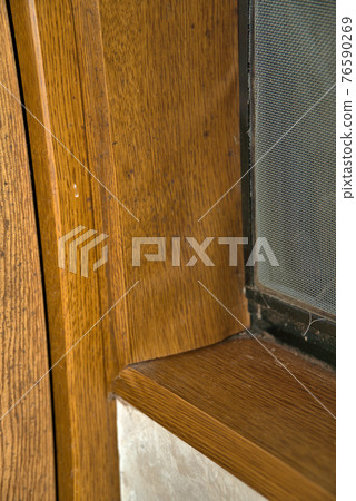 The surface of the window frame that has floated due to humidity 76590269