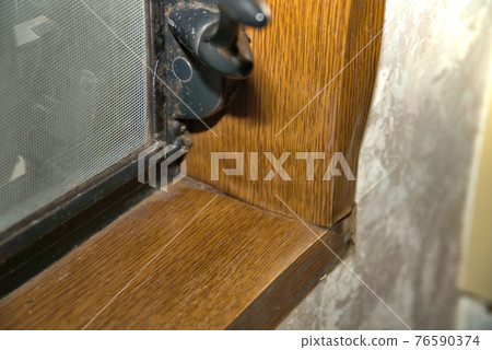 Moisture-wavy window frame surface, moldy crosspieces and jalousie window handles 76590374