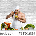 Man bodybuilder in white toque blanche and cook protective apron 76591989