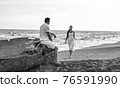 loving couple on seaside in white dress 76591990