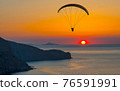 paraglider pilot fly in sky on beauty nature mountain and sea landscape 76591991