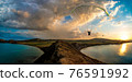 paraglider pilot fly in sky on beauty nature mountain and sea landscape 76591992
