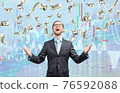 businessman trader winner, in cash rain of dollars notes 76592088