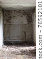 An empty, abandoned building. 76592101