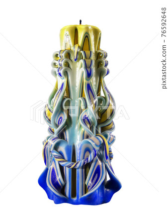 Curly multicolored candle isolated on black background Curly multicolored candle isolated on black background 76592648