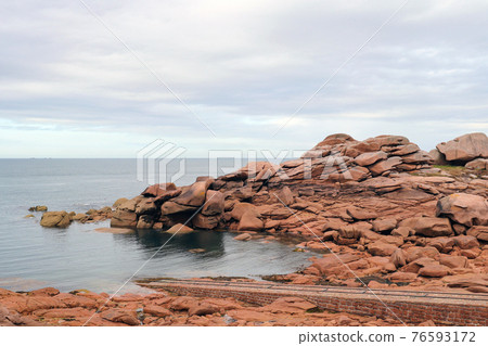 Pink granite coast near Ploumanach in Brittany 76593172