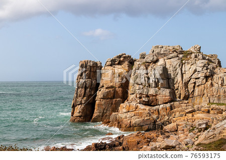Rocky cliffs on the Pink Granite Coast near Le Gouffre in Brittany Rocky cliffs on the Pink Granite Coast near Le Gouffre in Brittany 76593175