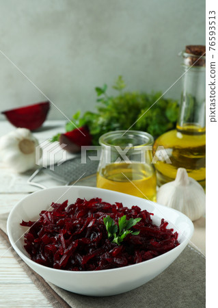 Concept of tasty eating with beet salad on white wooden background Concept of tasty eating with beet salad on white wooden background 76593513