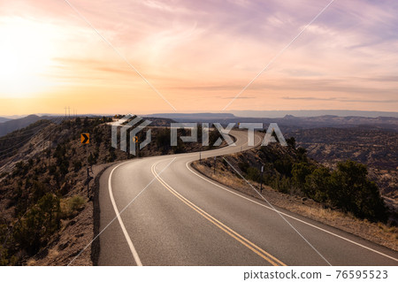 View of a scenic route on top of a mountain ridge in the desert. View of a scenic route on top of a mountain ridge in the desert. 76595523