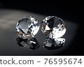 Couple of wonderful pure diamonds with reflections on black mirror background close up view. Jewelry diamonds sale, invitation, action, discount banner, poster, card template with copy space 76595674