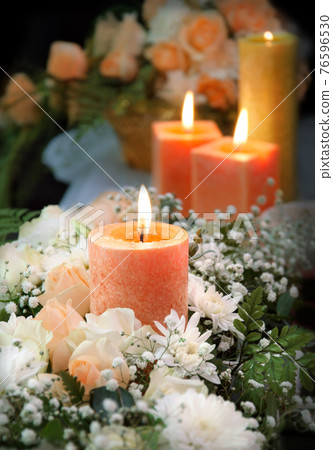 Candle on floral background Candle on floral background 76596530