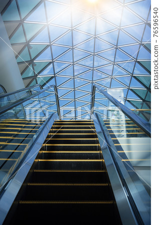 Modern escalator in shopping center Modern escalator in shopping center 76596540