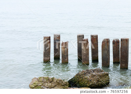Destroyed beach house in aftermath of hurricane and flood 76597256
