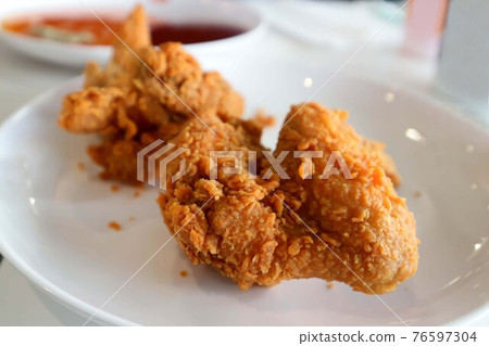 fried chicken, deep fried chicken 76597304