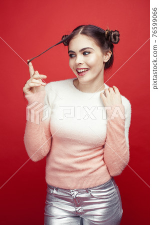 young pretty emitonal posing teenage girl on bright red background, happy smiling lifestyle people concept young pretty emitonal posing teenage girl on bright red background, happy smiling lifestyle people concept 76599066