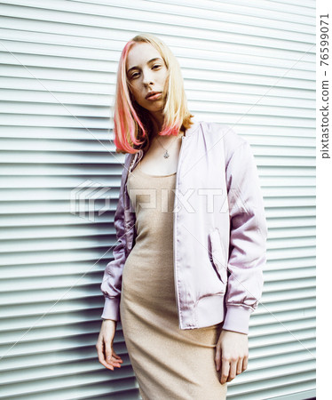 young pretty fashion dressed blong teenage girl posing friendly, lifestyle people concept 76599071