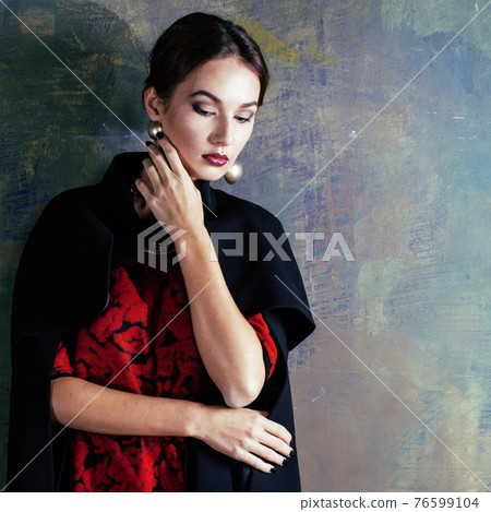 beauty rich brunette woman in luxury interior near empty frames, wearing fashion clothes, lifestyle people concept beauty rich brunette woman in luxury interior near empty frames, wearing fashion clothes, lifestyle people concept 76599104