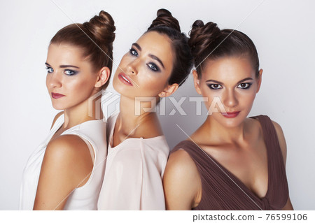 tree pretty stylish young woman with same hairstyle and makeup, best friend together having fun, lifestyle people concept 76599106
