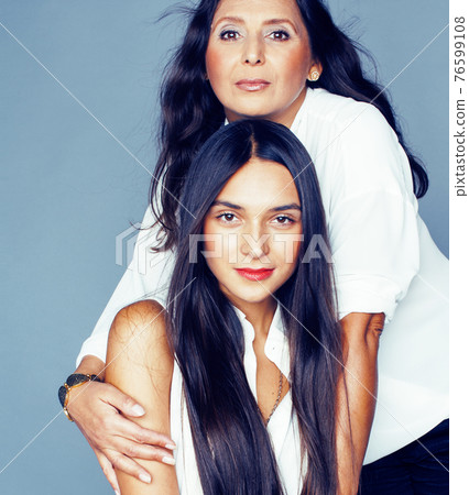 cute pretty teen daughter with mature mother hugging, fashion style brunette, lifestyle people concept cute pretty teen daughter with mature mother hugging, fashion style brunette, lifestyle people concept 76599108