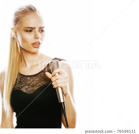 young pretty blond woman singing in microphone isolated close up karaoke young pretty blond woman singing in microphone isolated close up karaoke 76599111