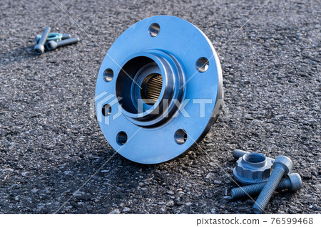 Part isolated. Set of new metal car part. Auto motor mechanic spare or automotive piece isolated on black ground asphalt texture. Tarmac dark grey grainy road. 76599468