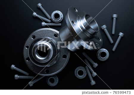 Sapre parts. Auto motor mechanic spare or automotive piece on dark background. Set of new metal car part. Repair and vehicle service with space for text. 76599473