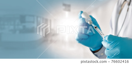 COVID-19 Vaccination, doctor holds syringe and bottle corona virus treatment vaccine COVID-19 Vaccination, doctor holds syringe and bottle corona virus treatment vaccine 76602416